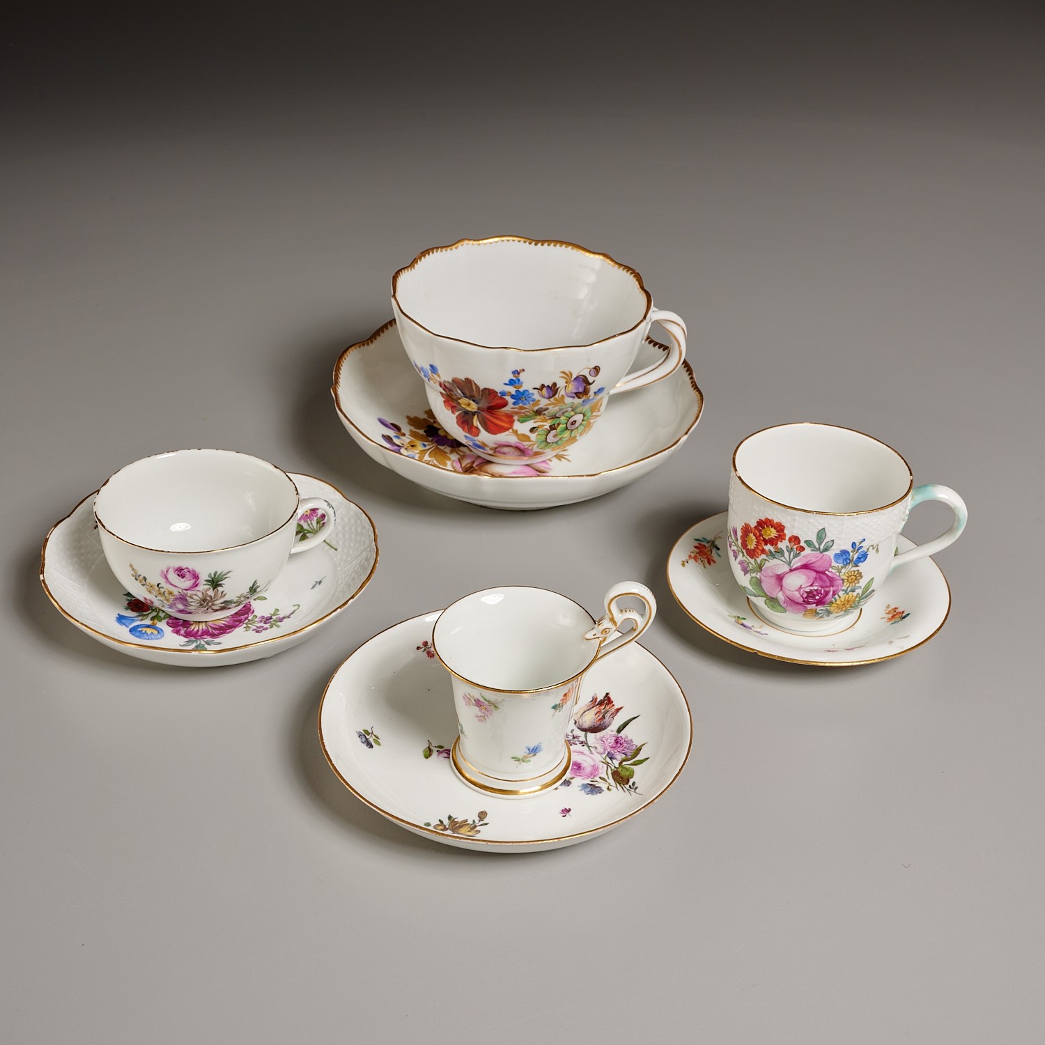  4 MEISSEN FLORAL CUPS AND SAUCERS 2a5fc5