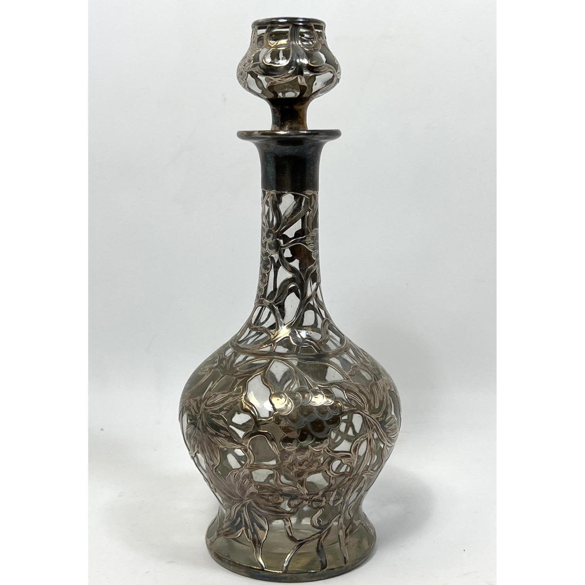 Silver overlay decanter. Marked Sterling.