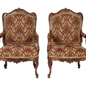 A Pair of Rococo Style Carved Walnut