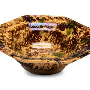 A Large Molded Yellowware Bowl with