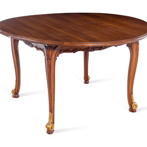 A Louis XV Style Parcel Gilt Walnut