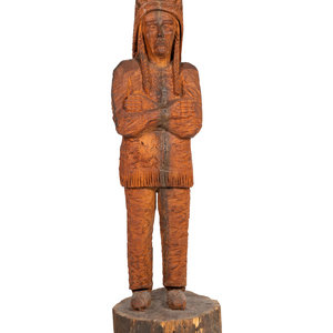 A Carved Wood Figure of an Indian