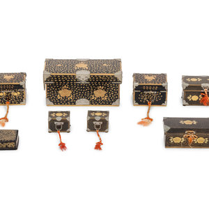 Eight Japanese Gilt and Black Lacquered