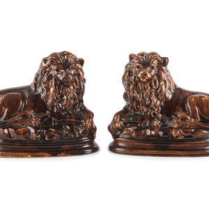 A Pair of Recumbent Lion Figures