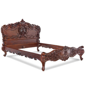 A Rococo Revival Carved Walnut
