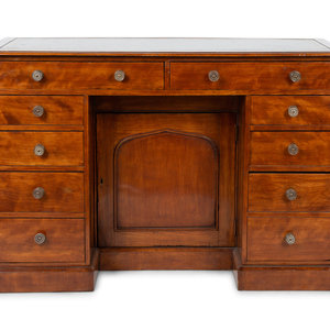 An English Mahogany Kneehole Desk
LATE