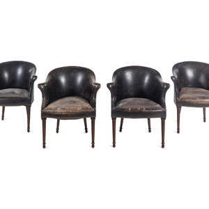 A Set of Four Leather Upholstered