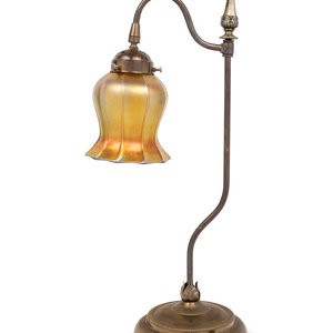 A Brass Table Lamp With Quezal
