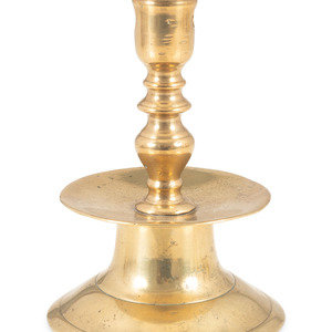A Continental Brass Heemskirk Candlestick
Likely