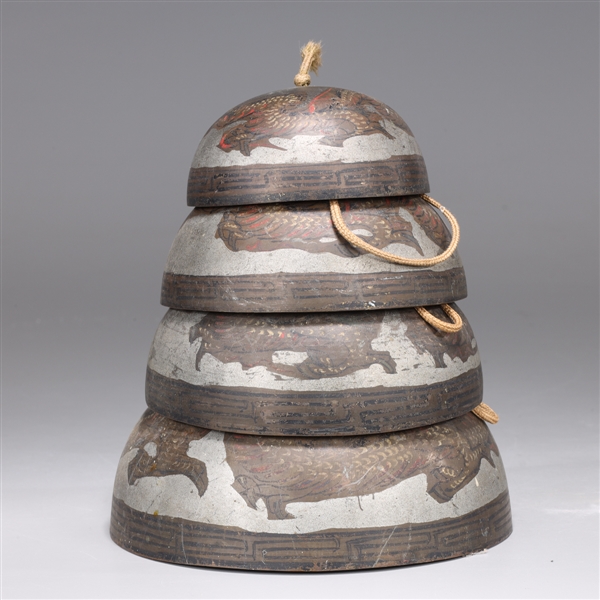 Set of four graduated bronze bells painted