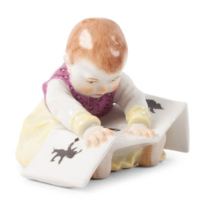 A Meissen Porcelain Baby Reading