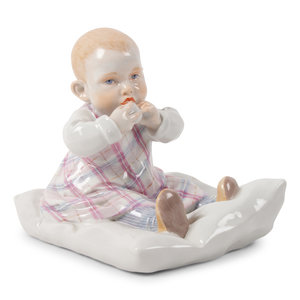 A Meissen Porcelain Figure of a Baby