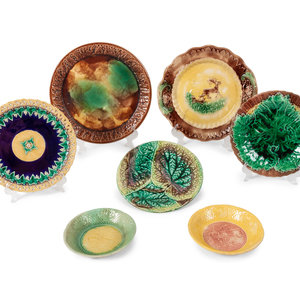 A Group of Fourteen Majolica Plates
includes