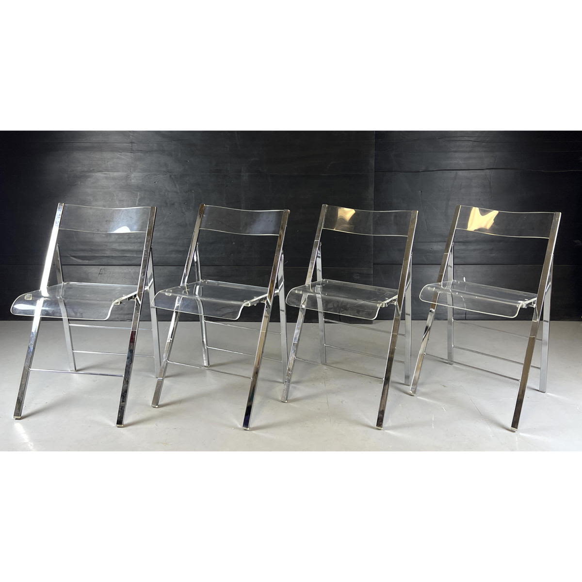 Set 4 Lucite Folding Chairs. 

Dimensions: