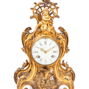 A Louis XV Gilt Bronze Clock and 2aa482