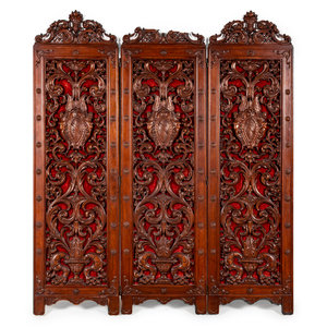 A Baroque Style Carved Walnut Three-Panel