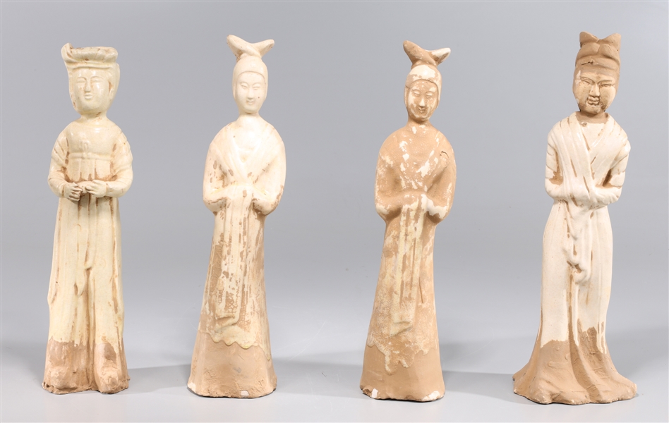 Group of four Chinese straw glazed standing