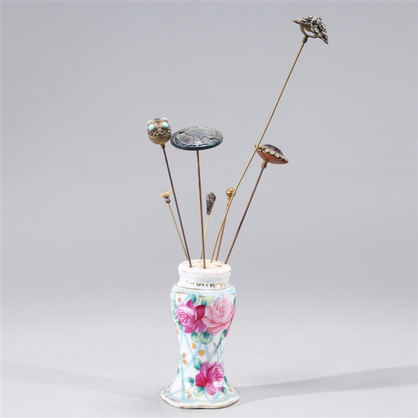 Group of various metal hairpins in porcelain