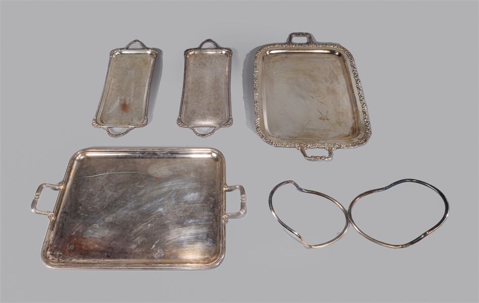 Group of five silver plate serving trays