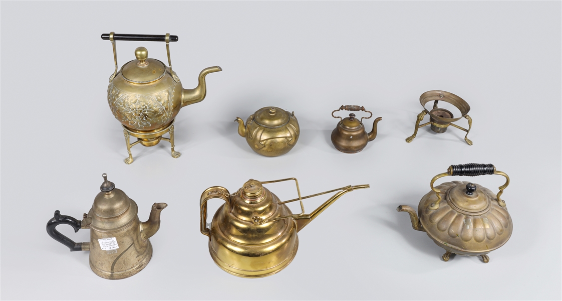 Group of eight antique brass teapots,