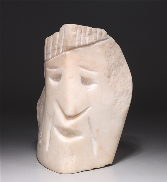 Carved abstract marble bust; natural