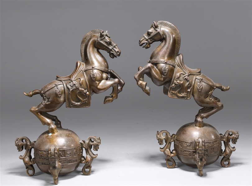 Pair of Chinese bronze horses with