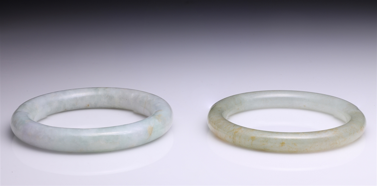 Two Chinese carved jadeite bangles,
