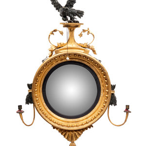 A Regency Parcel Ebonized Giltwood