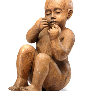 A Carved Wooden Sculpture of a Sleeping