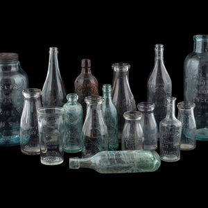 Sixteen Glass Advertising Bottles
20th