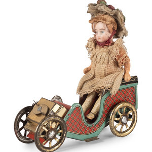 A D.R.G.M. Tin Car Toy with Doll