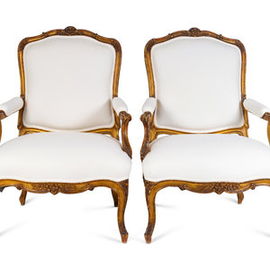 A Pair of Louis XV Giltwood Bergeres
LATE