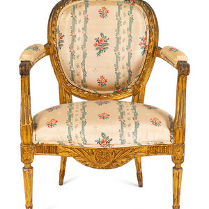 A Louis XVI Carved Giltwood Fauteuil
LATE