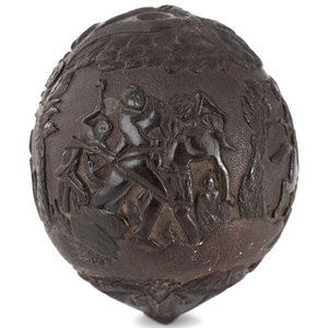 A Carved Coconut Depicting a Grisly
