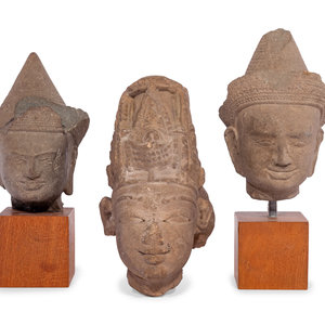 Three Carved Stone Heads of Buddha
comprising