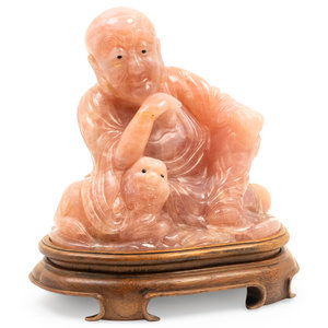 A Chinese Carved Rose Quartz Figure