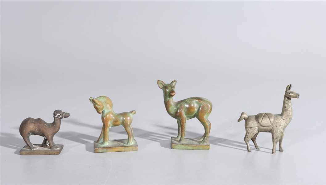 Four antique bronze animals including