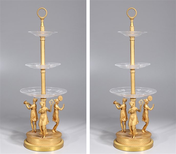 Pair of gilt metal three-tier stands,