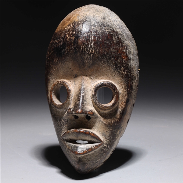Carved wooden mask in the style 2acf7d