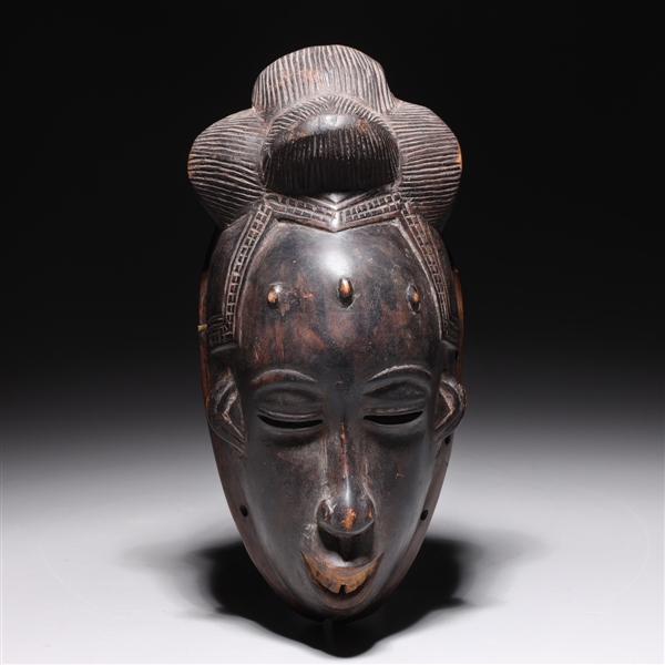 Carved wooden tribal mask from 2acf7f