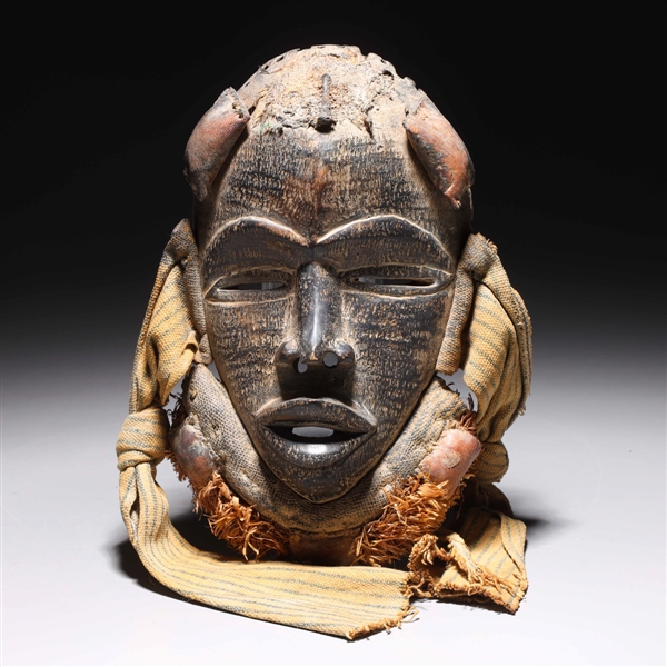 West African Dan mask with cloth