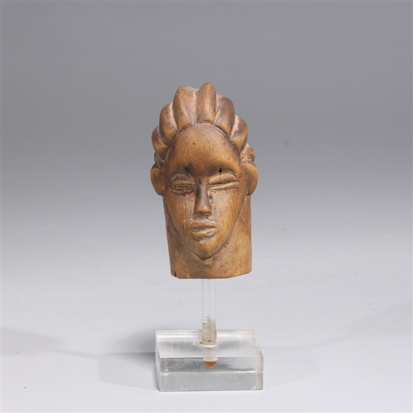 Carved wood West African figure head