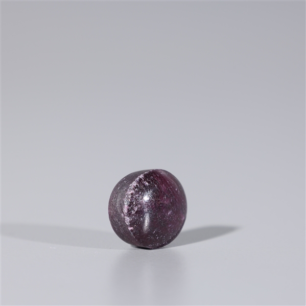 Single loose purple-red oval shaped