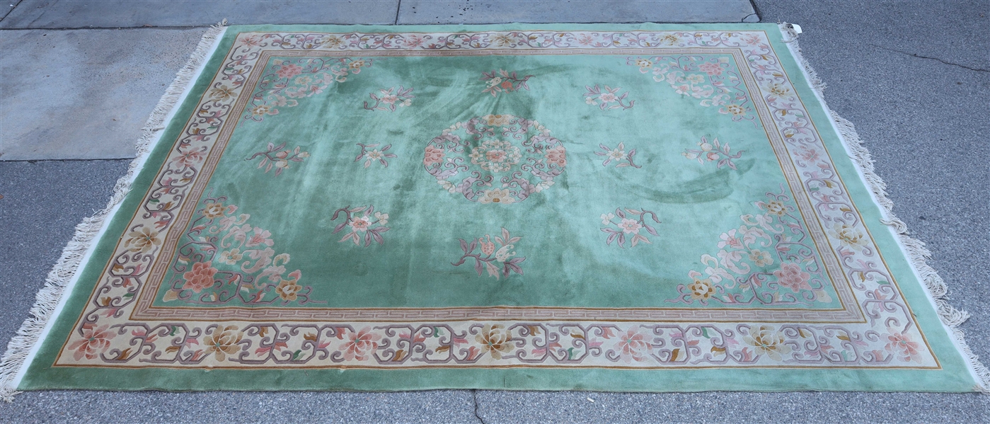 Large Chinese wool rug, green background