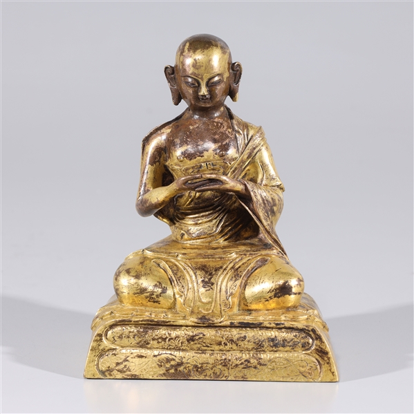 Sino Tibetan monk seated on plinth 2ad645