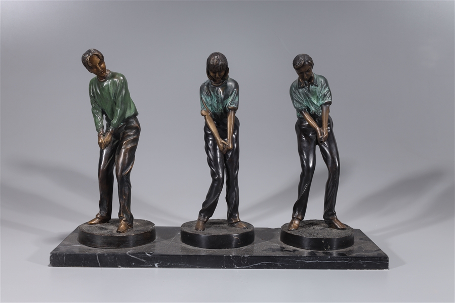 Group of three bronze golfers on 2ad800