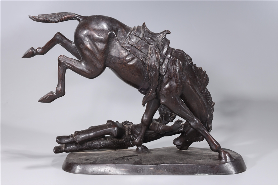 Bronze statue of horse and bucked