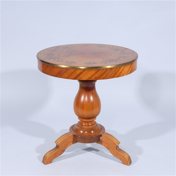 Small circular wooden side table with