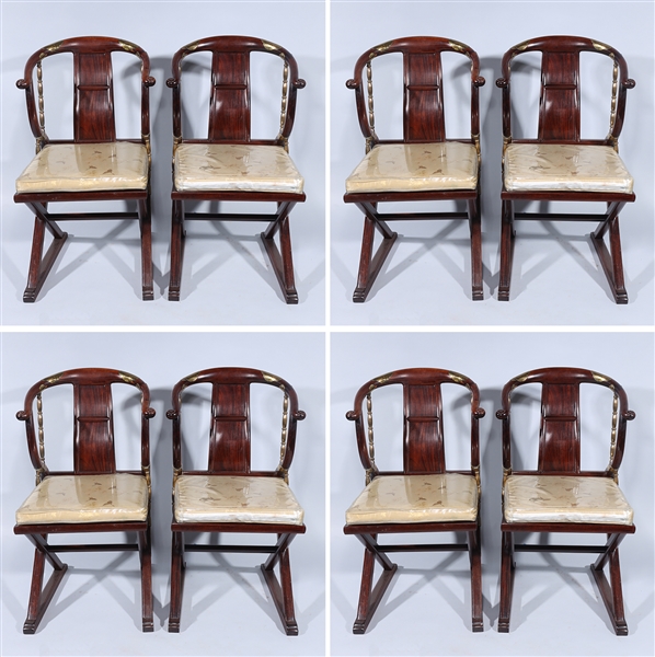 Eight wood dining chairs, including