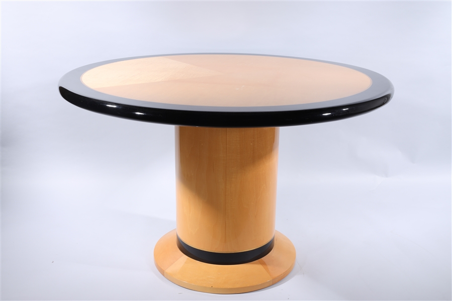 Circular table with blonde and black